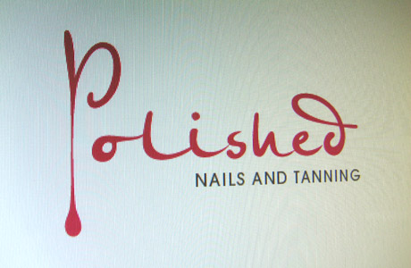 polished nails and tanning logo